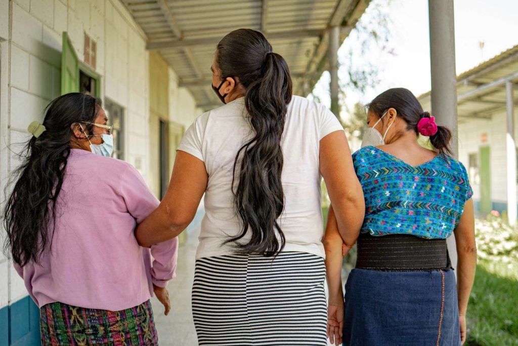A group of women standing next to each other